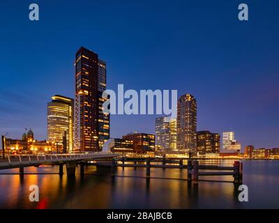 Rotterdam - 13 February 2019: Rotterdam, The Netherlands downtown skyline, several modern tall buildings on the waterfront at dusk in South Holland Stock Photo