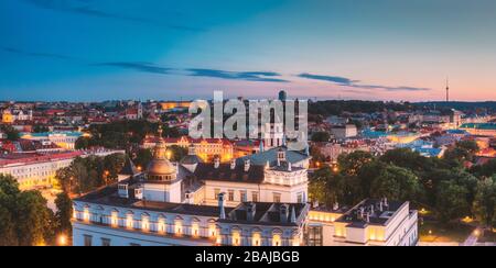 Vilnius, Lithuania, Eastern Europe. Night Panoramic View Of Historic Center Cityscape In Blue Hour. Travel View Of Old Town In Night Illuminations. UN Stock Photo