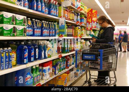 Woman buying cleaning product inside Walmart store Stock Photo - Alamy