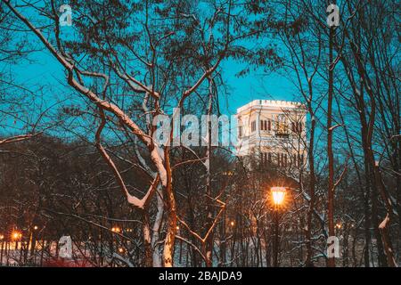Gomel, Belarus. City Park In Winter Night. Clock Tower Of Rumyantsevs And Paskeviches Palace In Homiel Park, Belarus. Famous Local Landmark. Stock Photo