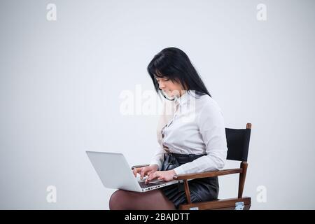 girl teacher, businessman is studying a new project on a laptop. Working day concept Stock Photo