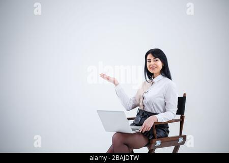 girl teacher, businessman is studying a new project on a laptop. Working day concept Stock Photo