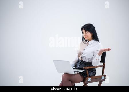 girl teacher, businessman is studying a new project on a laptop. Working day concept Stock Photo