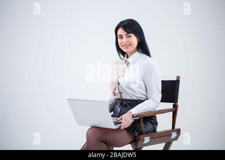 girl teacher, businessman is studying a new project on a laptop. Working day concept Stock Photo