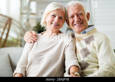 Happy senior couple relaxing together in their home Stock Photo