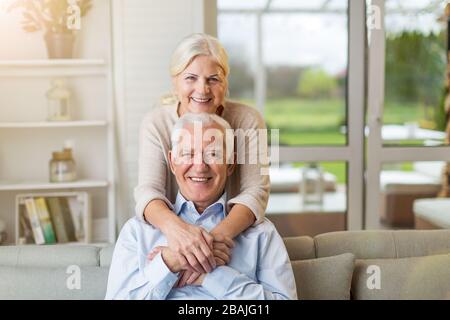 Happy senior couple relaxing together in their home Stock Photo