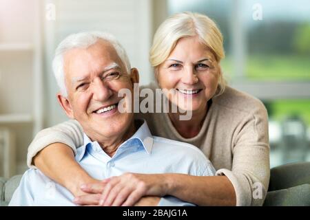 Happy senior couple relaxing together in their home Stock Photo