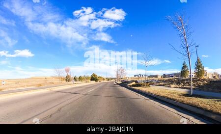 Driving on typical paved roads in suburban America. Stock Photo