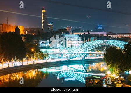 Tbilisi, Georgia - October 21, 2016: Evening Night Scenic View Of Skyscraper And Bridge Of Peace. Street Night Illumination Stock Photo