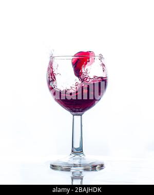 glass splash red wine with white background celebration Stock Photo