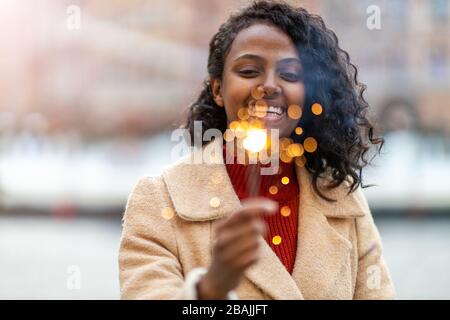 Beautiful young woman having fun on the Christmas Market Stock Photo