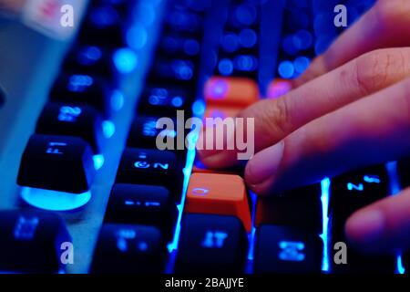 Gaming Keyboard. Professional cyber video gamer studio room with personal computer armchair, keyboard for stream. Stock Photo