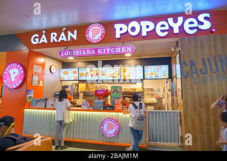 HANOI/VIETNAM - JULY 17 : Noi Bai International Airport (HAN) inside View Restaurant in the airport sign board Fried chicken shop pop eyes louisiana k Stock Photo