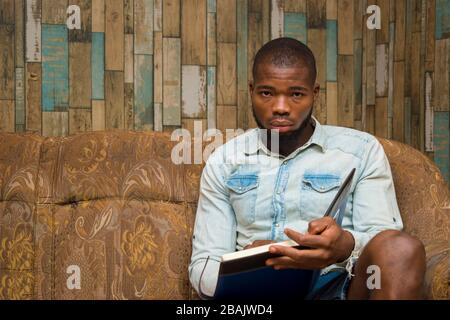 young african student seriously studying his note Stock Photo
