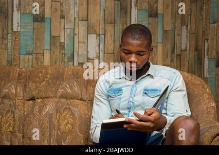 young african student seriously studying his note Stock Photo