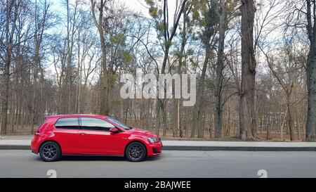 Ukraine, Kiev - March 27, 2020: Volkswagen Golf GTi TCR red in the forest Stock Photo