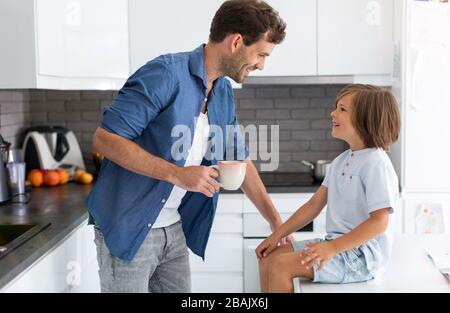 Father and son in the kitchen Stock Photo
