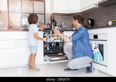 Father and son in the kitchen Stock Photo