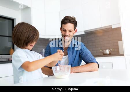 Father and son in the kitchen Stock Photo