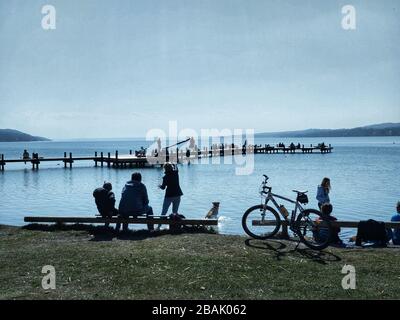 Lake Starnberg, Bavaria, Germany. 28th Mar, 2020. Despite the #stayinside and #savelives campaigns that run in addition to social and physical distancing guidelines, many in the Lake Starnberg area near Munich, Germany enjoy meeting in groups under sunny skies. Credit: Sachelle Babbar/ZUMA Wire/Alamy Live News Stock Photo