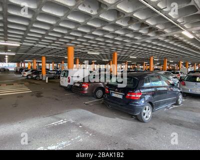 Paris, France - FEB 11, 2020: Multiple cars parked in large parking of a supermarket mall in French city, Mercedes, Skoda, Peugeot, Volkswagen Stock Photo
