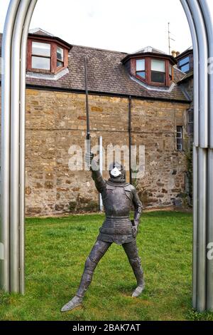 Alexandra Road, Elgin, Moray, UK. 28th Mar, 2020. UK. This is the statue for Alexander Stewart, Earl of Buchan, Alasdair Mór mac an Rígh, and called the Wolf of Badenoch (1343 - 20 June 1405), was the third surviving son of King Robert II of Scotland and youngest by his first wife, Elizabeth Mure of Rowallan. He has adorned his mask to fight COVID-19. Credit: JASPERIMAGE/Alamy Live News Stock Photo