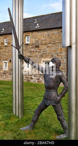 Alexandra Road, Elgin, Moray, UK. 28th Mar, 2020. UK. This is the statue for Alexander Stewart, Earl of Buchan, Alasdair Mór mac an Rígh, and called the Wolf of Badenoch (1343 - 20 June 1405), was the third surviving son of King Robert II of Scotland and youngest by his first wife, Elizabeth Mure of Rowallan. He has adorned his mask to fight COVID-19. Credit: JASPERIMAGE/Alamy Live News Stock Photo