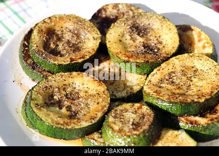Traditional Finnish summer cottage food every Finn loves to enjoy during midsummer fest and summertime in general. Delicious homemade grilled zucchini Stock Photo