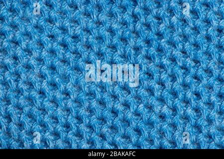 Blue knitted fabric background texture for design, trend color classic blue. Stock Photo