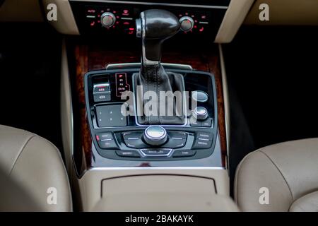 Automatic transmission gear, car interior. Automatic gear stick of a modern car, interior details, close up. Car detailing. Transmission lever Stock Photo