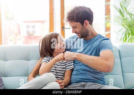 Father playing with his children at home Stock Photo