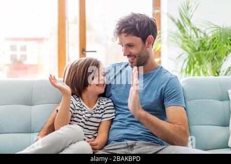 Father playing with his children at home Stock Photo
