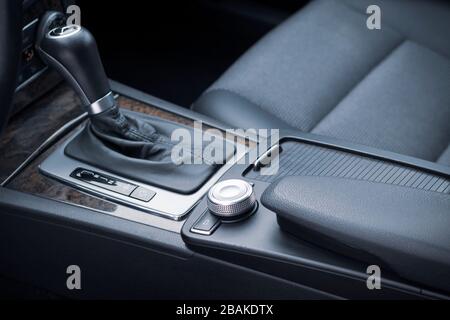 Automatic transmission gear, car interior. Automatic gear stick of a modern car, interior details, close up. Car detailing. Transmission lever Stock Photo