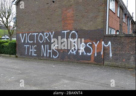Graffiti supporting the NHS painted on gable wall of house in the Bogside, Derry, Northern Ireland. ©George Sweeney / Alamy Stock Photo Stock Photo