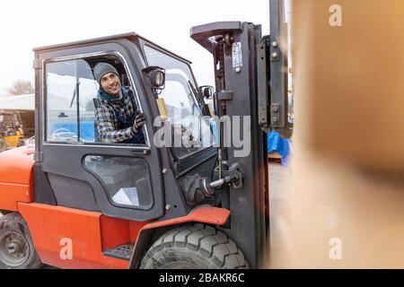 Young male worker in timber warehouse Stock Photo