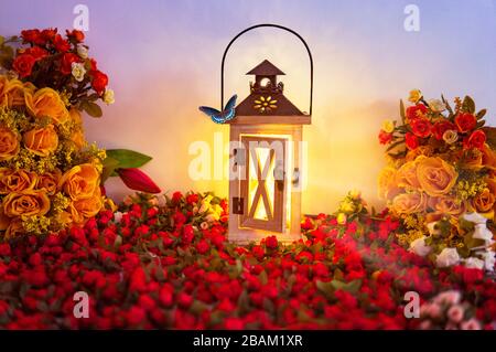 Spring Season Flowers And Butterfly On Craft Light Box Emitting Light In a Magical Creative Scene Stock Photo