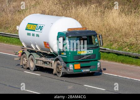 Premier LPG tanker; Haulage delivery trucks, lorry, transportation, truck, cargo carrier, Volvo vehicle, European commercial transport, industry, M61 at Manchester, UK Stock Photo