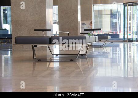 Empty benches in an office lobby Stock Photo