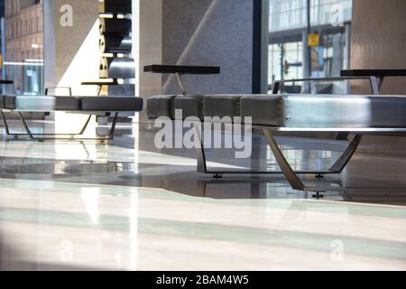 Empty benches in an office lobby Stock Photo