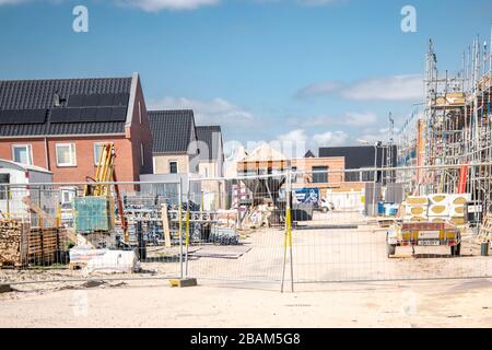Urk Netherlands 28 March 2020, Empty construction site in the Netherlands with newly build house during the corona or covid 19 outbreak many workers Stock Photo