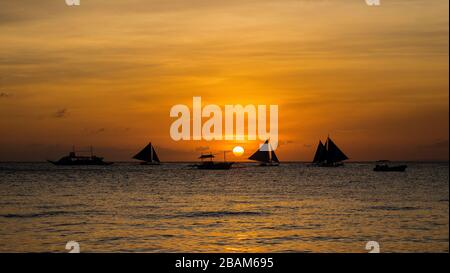 White beach sunset on Boracay island, Philippines. Stock Photo