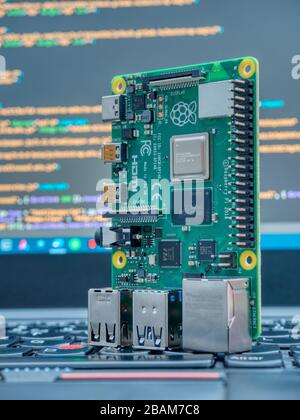 Galati, ROMANIA - March 22, 2020: Close-up of a Raspberry Pi 4 Model-B on a laptop keyboard. The Raspberry Pi is a credit-card-sized single-board comp Stock Photo