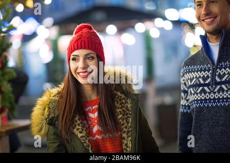 Young Couple Having Fun Outdoors At Christmas Time Stock Photo