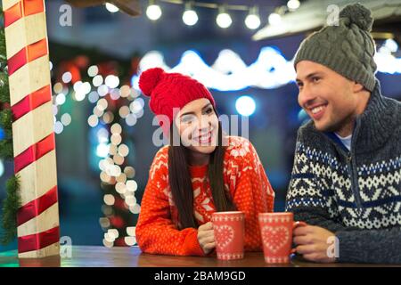 Young Couple Having Fun Outdoors At Christmas Time Stock Photo