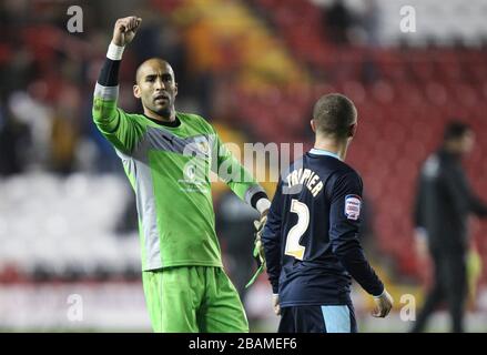 Burnley goalkeeper Lee Grant (left) celebrates after the game Stock Photo