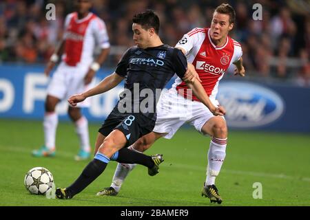 Ajax Amsterdam's Niklas Moisander and Manchester City's Samir Nasri (left) Stock Photo