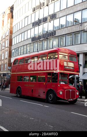 an old Routemaster London bus on the number 15 route to Tower Hill in London Stock Photo