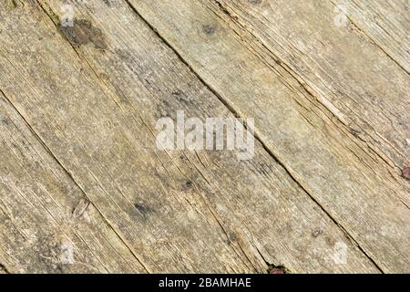 Weathered wooden slats of a farmyard trailer. Showing signs of weathering and ageing. Wood slat texture background, straight lines concept. Stock Photo
