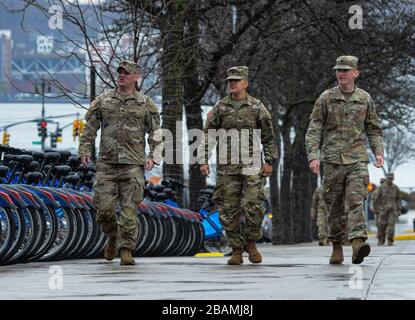 New York Manhattan, USA. 28th Mar, 2020. Army National Guard walking out side the The Javits Convention Center. New York Gov. Andrew Cuomo announced the construction of a temporary hospital at the the Jacob K. Javits Center had been completed with the help of FEMA and the National Guard. New York State has over 26,000 cases and 450 people died from the pandemic in NYS in the past 24 hours. 03/28/20. New York Manhattan. Marcus Santos. Credit: Marcus Santos/ZUMA Wire/Alamy Live News Stock Photo