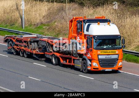 DAF Haulage delivery trucks, oversize loads, abnormal, contractors,  lorry, transportation, De Rooy truck, Uitzonderlijk Vervoer cargo carrier, DAF CF vehicle, lorry carrying lorry, European commercial transport, industry, M6 at Manchester, UK Stock Photo